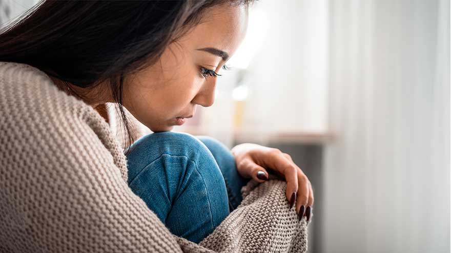 woman crying - Suffering With Loss During The Holidays And Managing Addiction Recovery