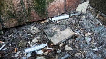 used syringes on the ground of a city street - The Worst Cities & Counties For Drug Problems In Ohio