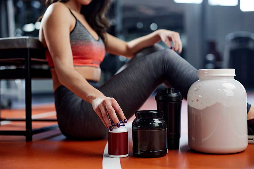 Woman Taking Pre Workout Supplements-Can You Snort Pre-Workout?
