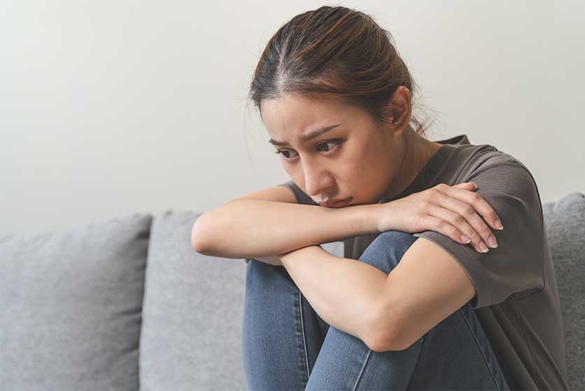 Woman having heroin withdrawal symptoms-Heroin Withdrawal | Symptoms, Timeline, PAWS, & Detox