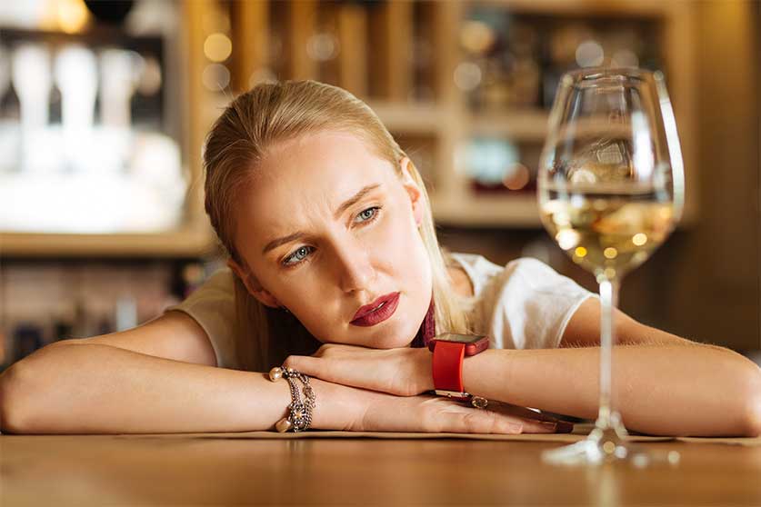Depressed Woman Drinking Wine-Short-Term Effects Of Alcohol Misuse