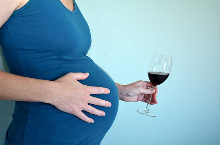 Pregnant Woman With A Glass Of Wine-Fetal Alcohol Syndrome | Symptoms, Causes, & Treatment