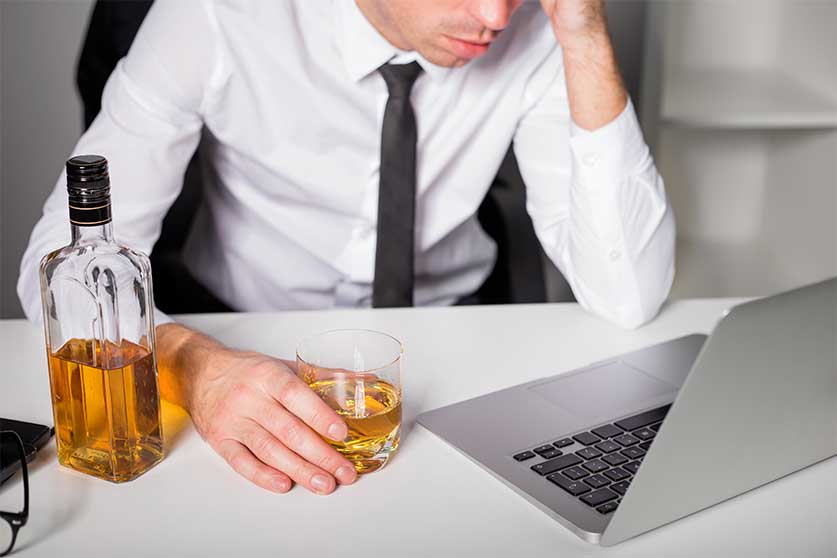 Man Drinking In The Office-Alcohol Abuse In The Workplace | Effects, Detection, & Prevention