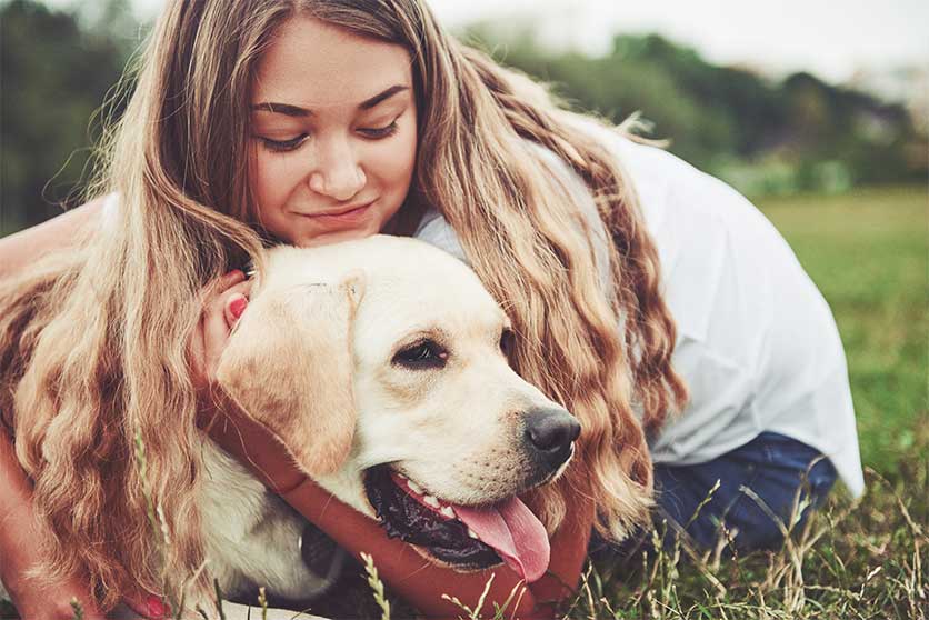 Woman Spending Time With Her Dog-What To Do With Your Dog During Inpatient Rehab